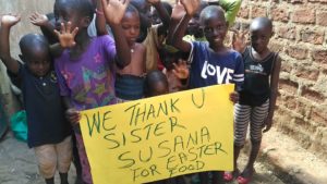 Children from Bunakigiya, Uganda Thanking Sister Susana for Easter Food.
