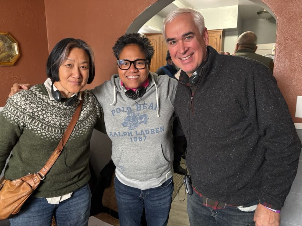 Dan Wright standing with two others on the set of the short film in Detroit.